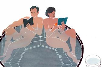 couple in hottub reading